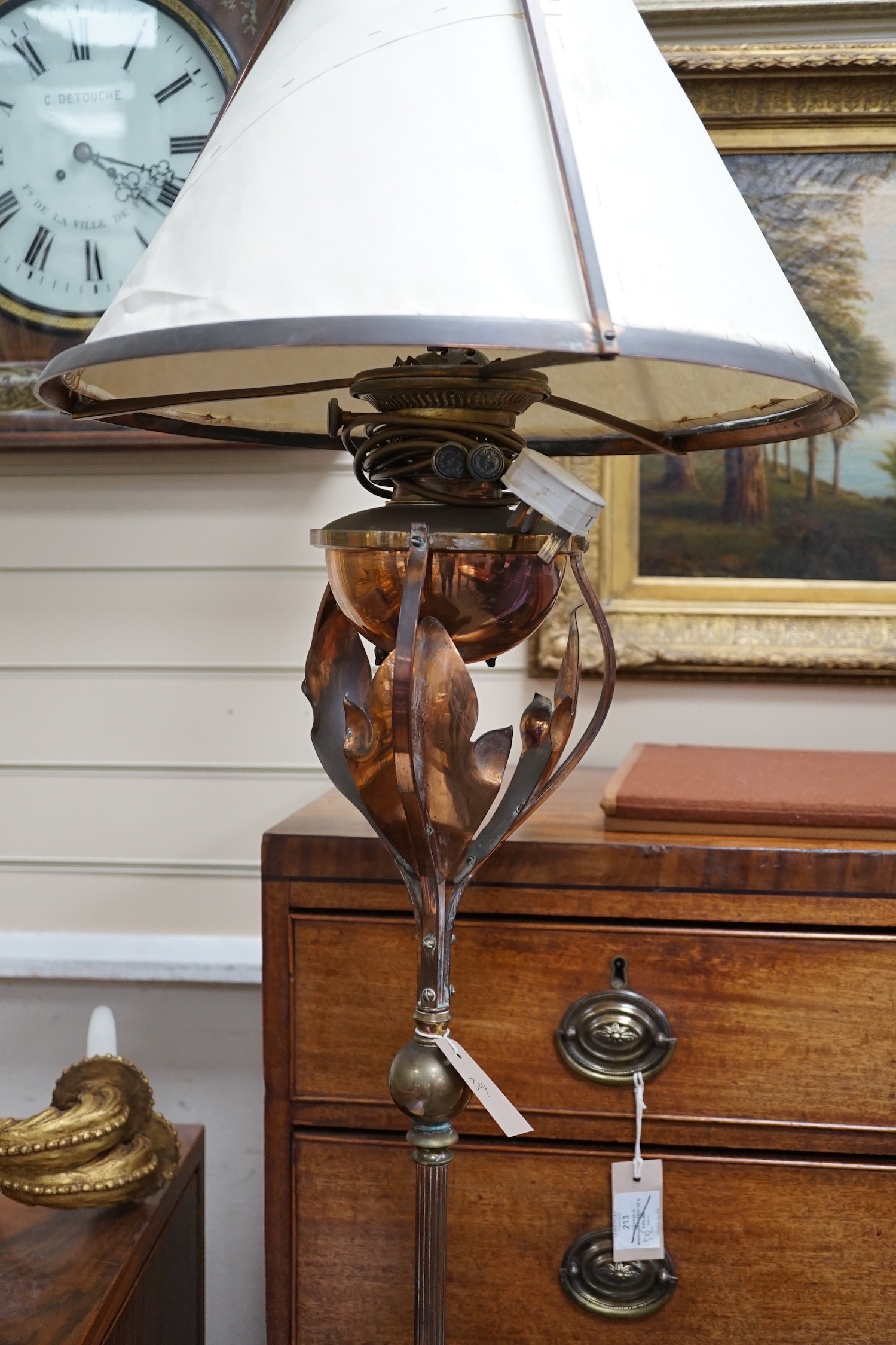 A 1920's brass and copper oil lamp standard converted to electricity, height overall 161cm *Please note the sale commences at 9am.